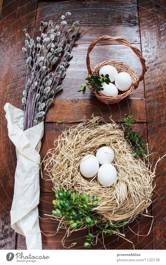 Easter composition of eggs and catkins on wooden table Decoration Table Spring Paper Wood Natural Brown Green Tradition boxwood candid Egg Hay Nest straw Top