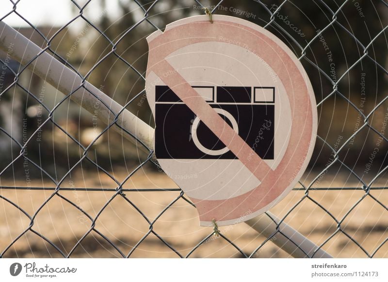 Broken "No photography" sign on wire mesh fence Take a photo Industry Construction site Fence Metal Signage Warning sign Old Hideous Gloomy End Mysterious