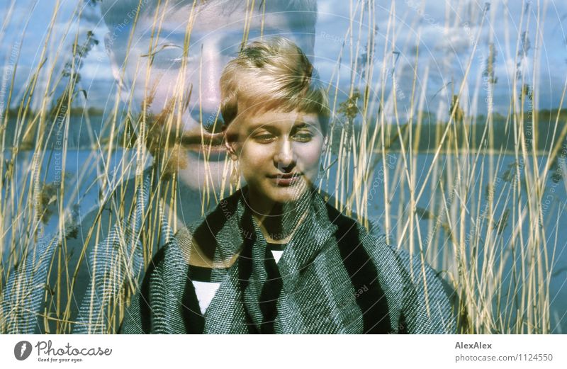analogue double exposure of a young woman standing in front of reeds at a lake Trip Adventure Far-off places Freedom Young woman Youth (Young adults) Face