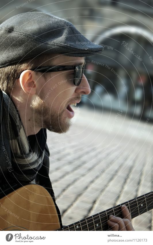 street musicians Young man Youth (Young adults) Singer Musician Guitar Busker Guitarist Sunglasses Scarf Hat Facial hair Uniqueness Exterior shot