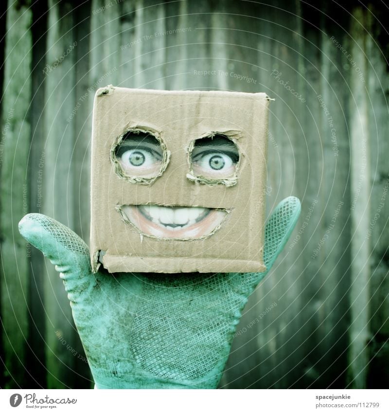Living in a box Man Cardboard Whimsical Humor Wall (building) Freak Square Wood Gloves Glove puppet Joy Face Mask Hiding place Hide square skull