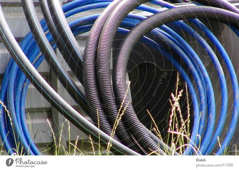 https://www.photocase.com/photos/11290-cable-construction-hose-electricity-furrow-things-photocase-stock-photo-large.jpeg