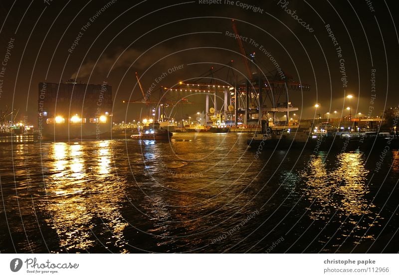 Night shot of a departure of a container ship in the port of Hamburg Port of Hamburg Logistics Container cargo Harbour Container ship Dockside crane Industry