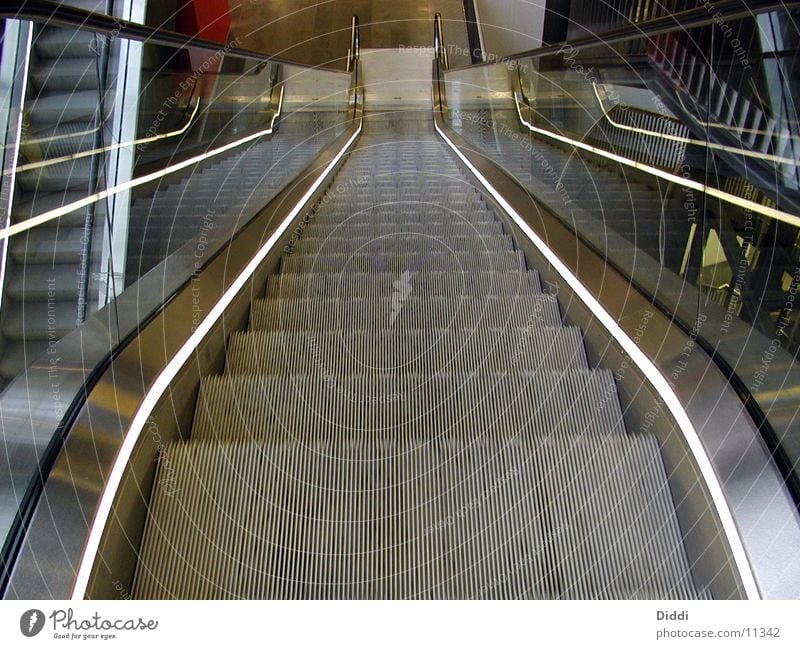 escalator Escalator Above Architecture Stairs Movement as of Wasted journey Empty Deserted Central perspective Metal Downward Banister Glass Lighting