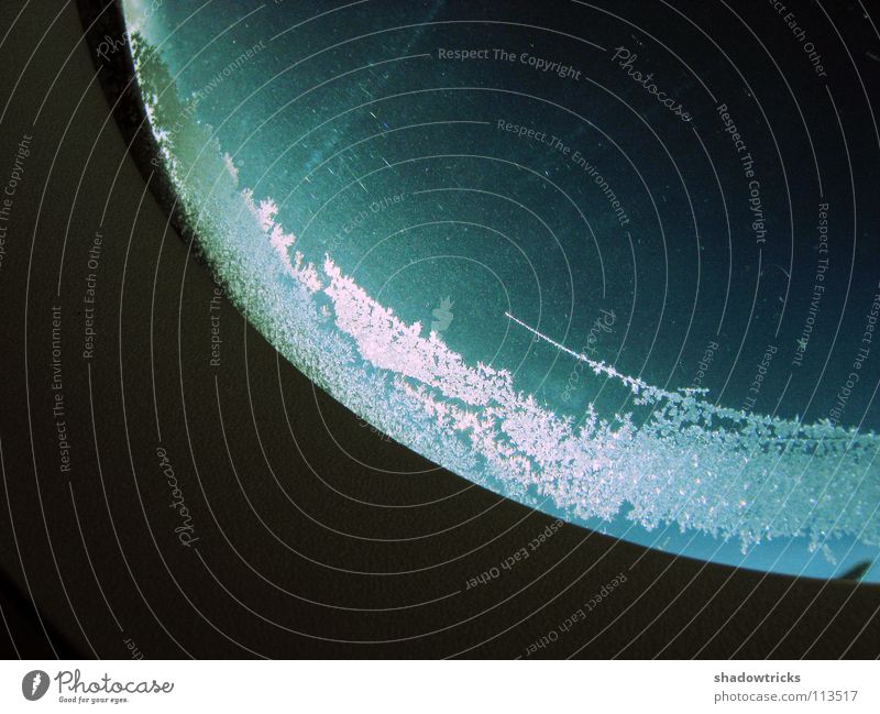 Ice on airplane window Airplane Cold Green Turquoise Astronautics Apollon Radiation Light White Icicle Ice crystal Window Aviation Crystal structure Sky Blue