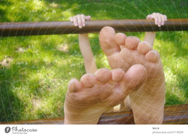 Bare Feet of a Little Girl Hanging in the Air Stock Image - Image