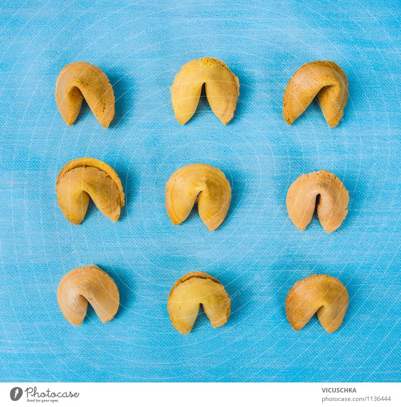 Traditional fortune cookies on a blue background Dough Baked goods Dessert Lunch Asian Food Style Design Entertainment Restaurant Background picture Top Humor