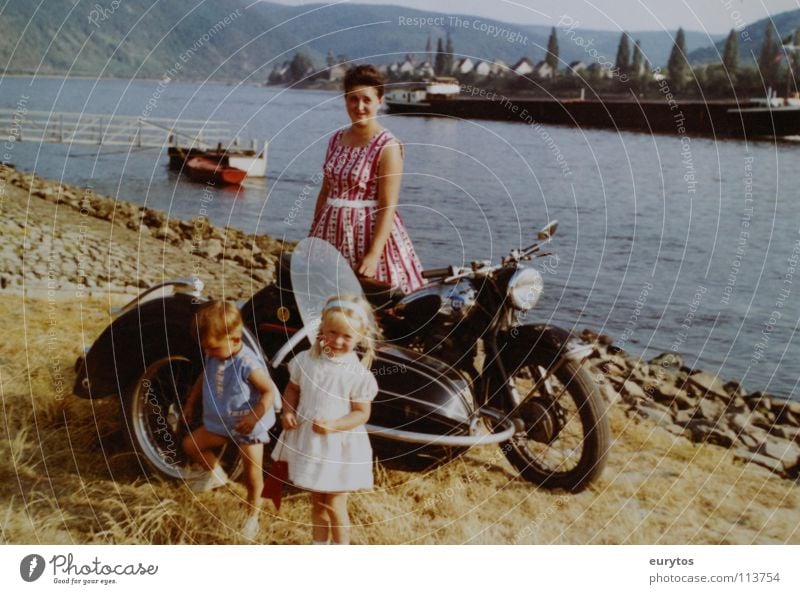 Economic Miracle Years... Motorcycle Mosel (wine-growing area) Watercraft Girl Child Mother Safety (feeling of) Dress Peace bmw sidecars Rhine River Boy (child)