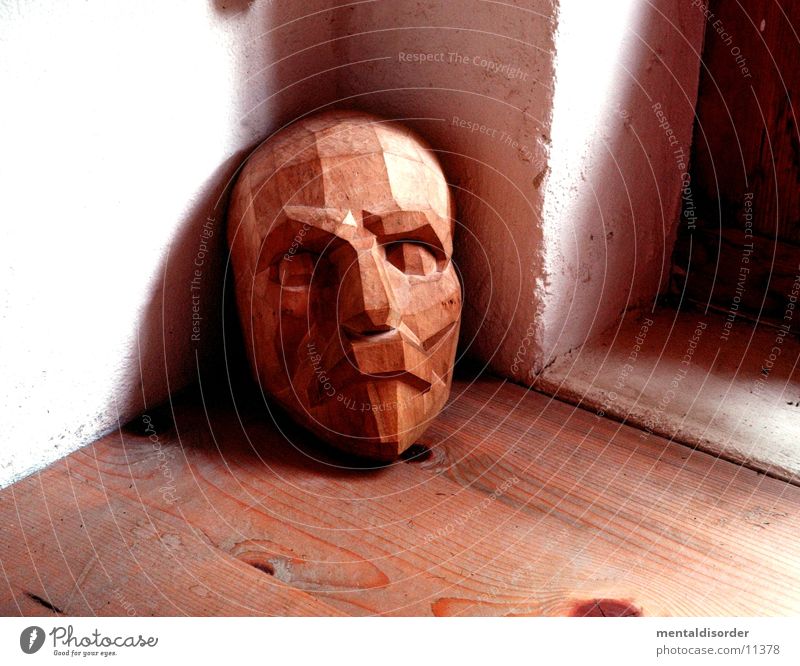 Mask made of wood Wood Brown Window White Pattern Obscure Face Corner Nature Floor covering Hallway Frame Eyes Nose Mouth Head Looking Shadow Wood grain