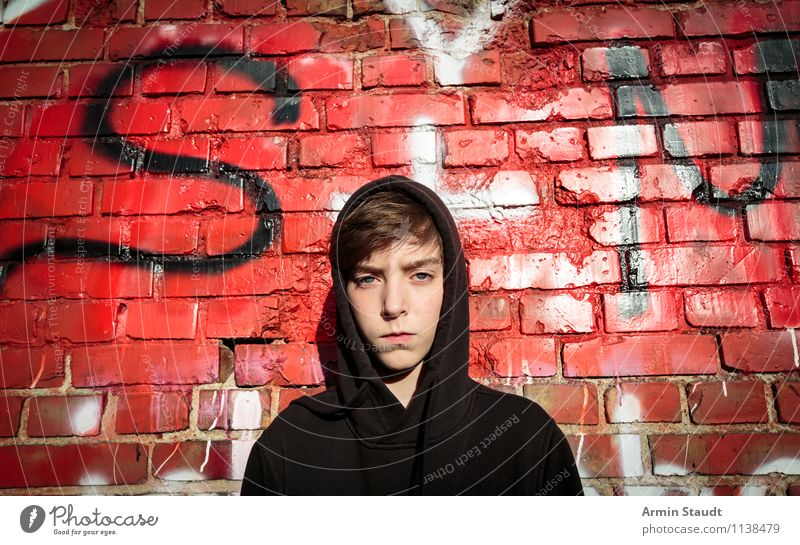 Portrait of a teenager with hoodie in front of a graffiti wall Graffiti Young man Lifestyle Style Design Human being Masculine Youth (Young adults) Head 1