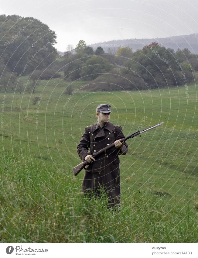 Home front. Rifle Uniform Meadow Tree Baseball cap Coat Bayonet Clouds Gray War Backpack Forest Man Army Soldier Fight Obscure Pasture Nature was Front side