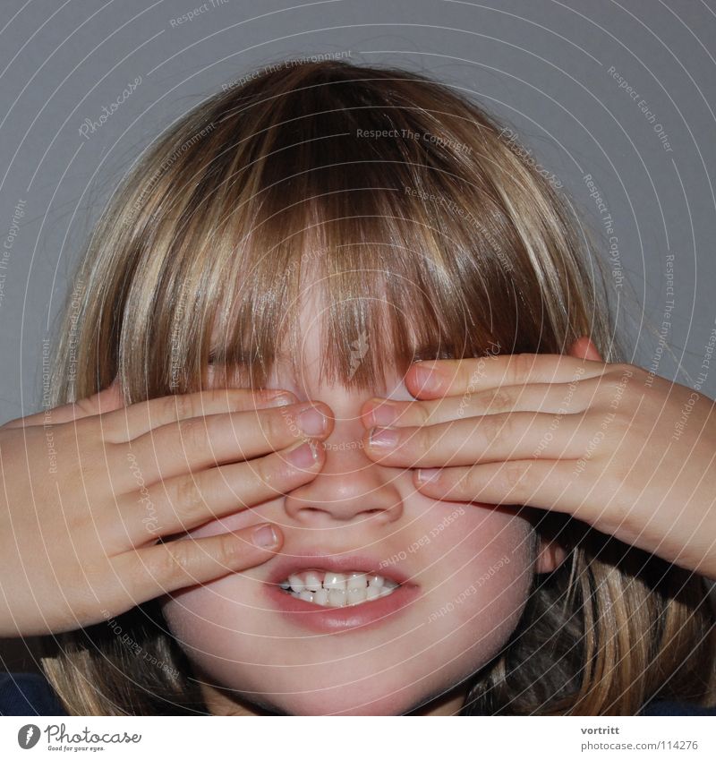 eyes to and through Portrait photograph Child Girl Lips Hand Fingers Blind Dark Playing Small Kindergarten Concealed Joy Hair and hairstyles Looking Fear Nose