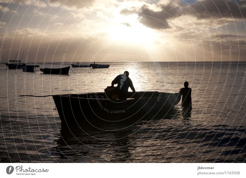 Fishing boat and fishermen in the sunset Watercraft Fisherman Silhouette Sunset Sunrise Evening Morning Twilight Shadow Ocean Vacation & Travel Fishing (Angle)