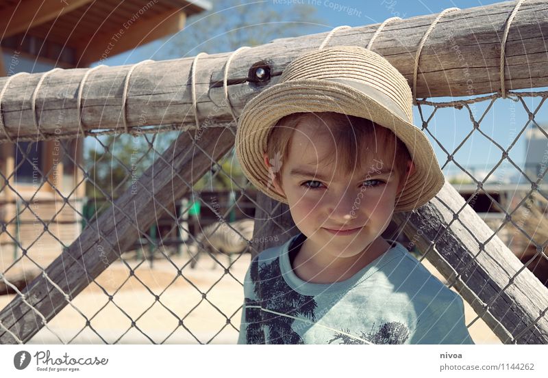 Boy with sun hat on safari in zoo Child Boy (child) Infancy Face 1 Human being 3 - 8 years Plant Animal Cloudless sky Beautiful weather Desert T-shirt Hat Cap