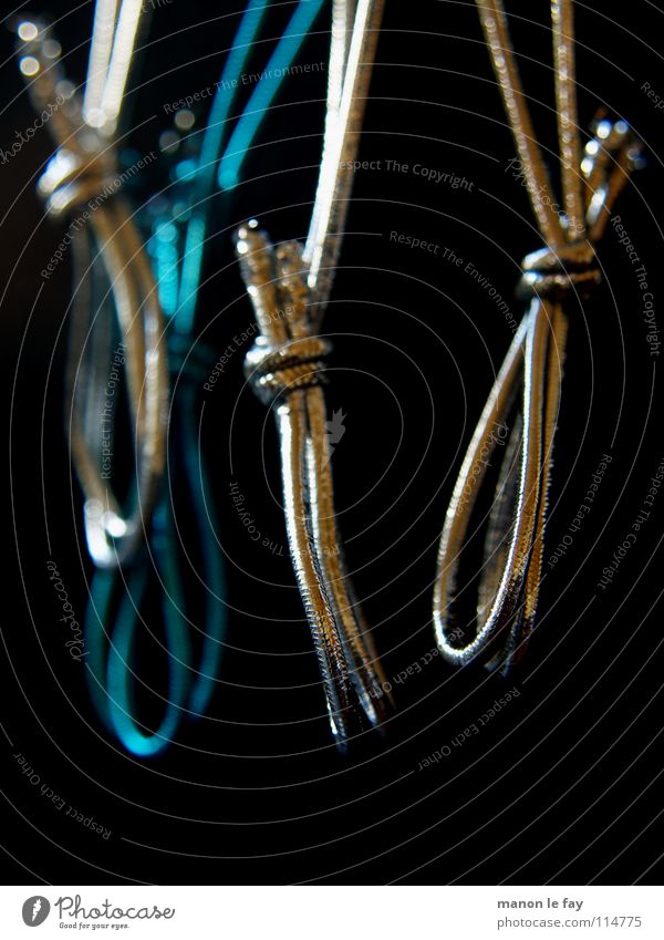 After the feast is before the feast Black Hang Hang up Bond Macro (Extreme close-up) Close-up Blue Silver String Elastic band Object photography Dark background