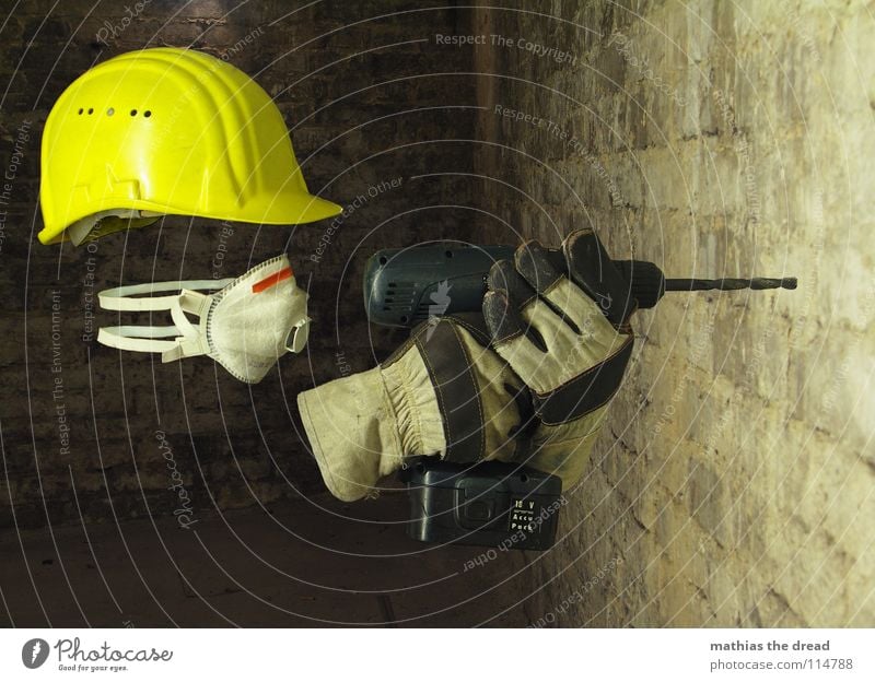 Masked Work and employment Construction worker Helmet Construction site helmet Yellow Warning colour Face mask Breath Gloves Work gloves Drill Cellar Dark