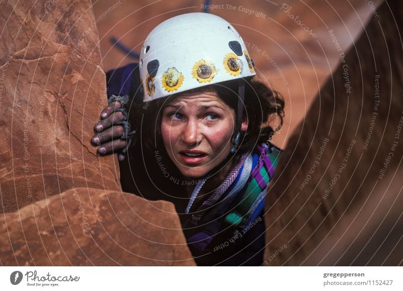 Female rock climber claws towards the summit. Relaxation Adventure Climbing Mountaineering Success Rope Woman Adults Rock Peak Self-confident Power Brave