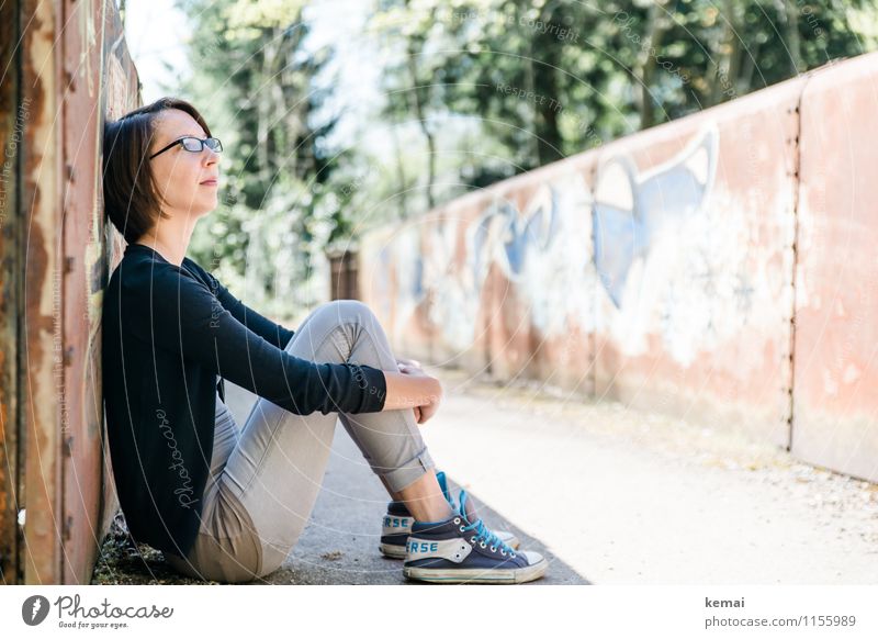 Young woman sitting leaning against a wall in the shade Lifestyle Style Leisure and hobbies Freedom Human being Feminine Youth (Young adults) Adults 1
