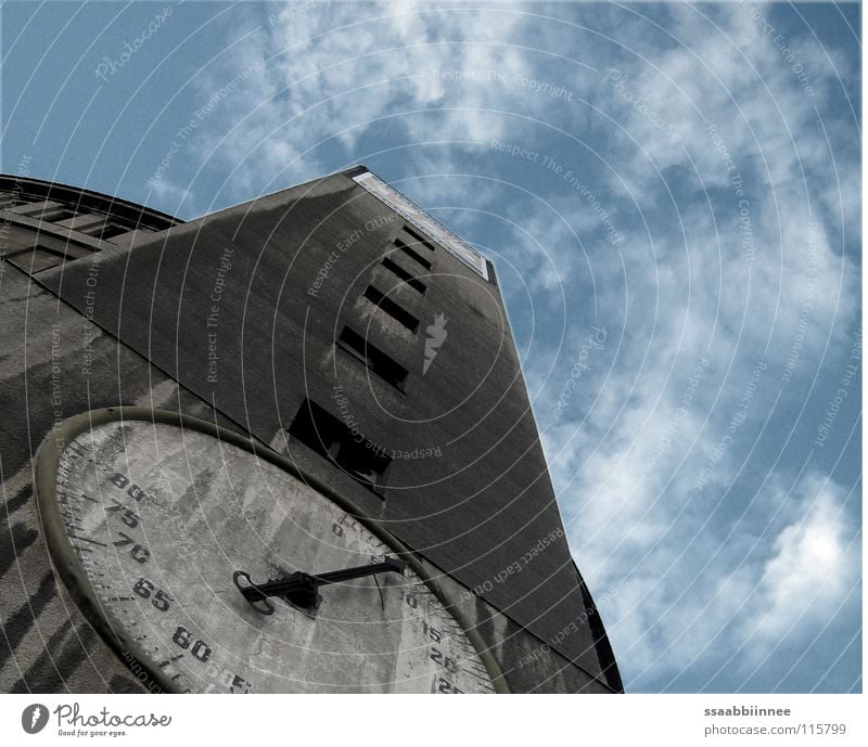 untimeliness Gasometer Clock face Building Derelict Dresden Gray Clouds Industrial construction Detail Industry Clock hand Sky Level Old