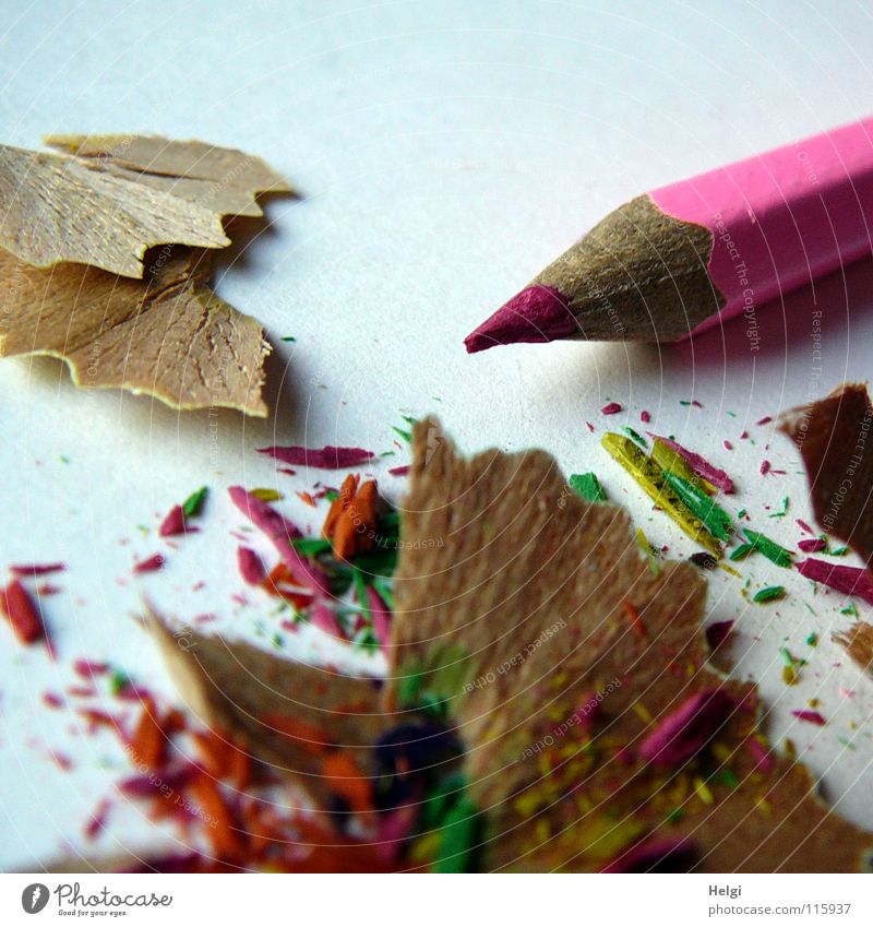 sharpened crayon lies on the table with the waste Sharpened Sharpener Pen Crayon Wood Facial expression Multicoloured Trash Long Thin Pink Paper Block Together