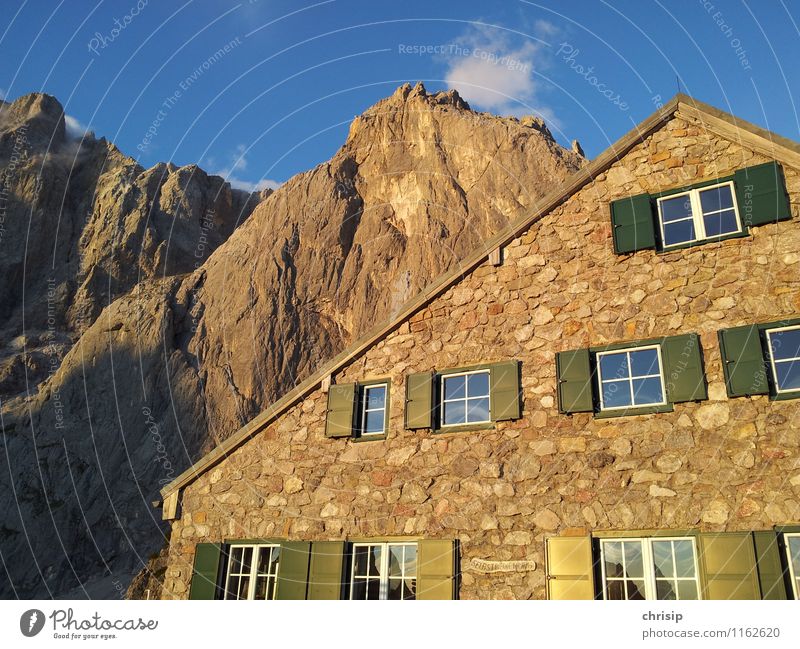 green bars Environment Nature Landscape Sky Clouds Sunlight Bad weather Rock Mountain Peak House (Residential Structure) Hut Manmade structures Wall (barrier)