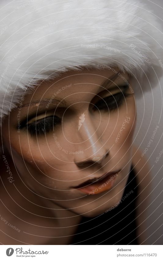 Close up portrait of a female shop mannequin with a Christmas Santa hat on her head. Woman Human being Mannequin False Fraud Model Decoration Christmas & Advent