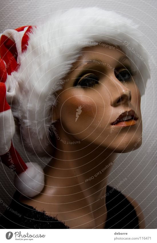 Portrait of a female shop mannequin with a Christmas Santa hat on her head. Woman Human being Mannequin False Fraud Model Decoration Christmas & Advent huge