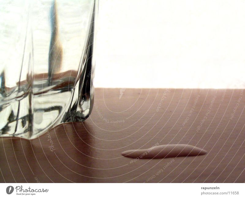 Splash of whiskey from an ice cube in glass Stock Photo by Alexlukin