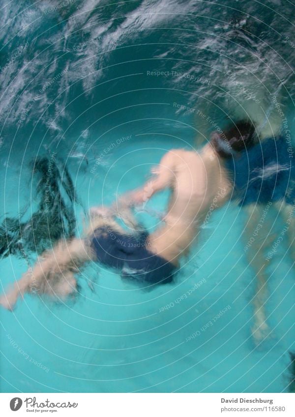 Behind thick ice Swimming & Bathing Dive Surface of water Whirlpool Turquoise Blur Swimming pool 2 people Swimming trunks Youth (Young adults) Adults Young man