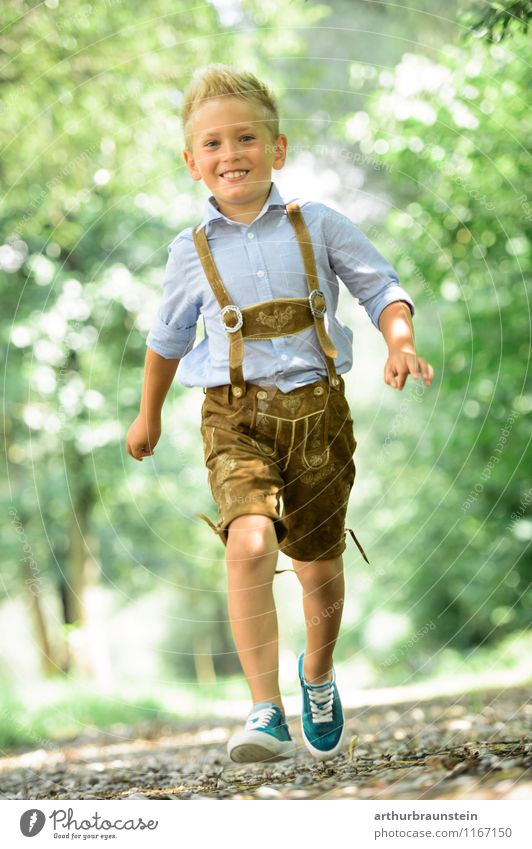 Blond boy in traditional costume Joy Athletic Playing Vacation & Travel Tourism Trip Summer Summer vacation Human being Masculine Child Boy (child) Infancy 1