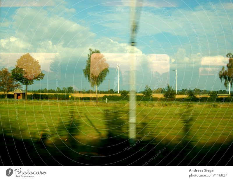 A train ride, etc. Driving Train travel Window Looking Boredom Roll Electricity Overhead line Danger of Life Reflection Tree Clouds Field Meadow Bushes Speed