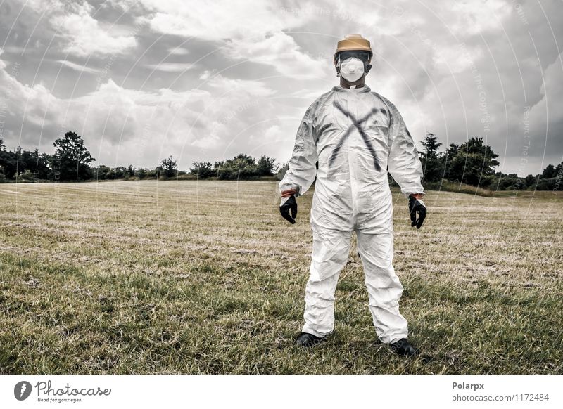 Man in protection suit Science & Research Work and employment Profession Industry Human being Adults Nature Clouds Grass Suit Gloves Stand Strong Yellow Safety
