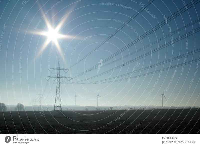 Motorway I Electricity Electricity pylon Metal Grating Gray Manmade structures Dangerous Yellow White Winter Sharp Flashy Field Brown Agriculture Renewable