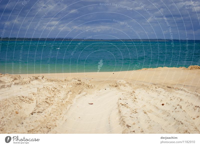 Sand, sea and blue sky and dark clouds. At the beach of Fraser Island at the east coast of Queensland / Australia Joy Calm Leisure and hobbies Trip Beach Ocean