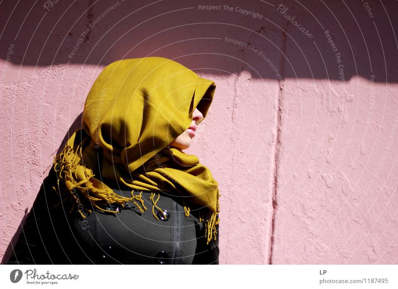 Profile Of A Girl Wearing Mustard Scarf Against A Pink Background A Royalty Free Stock Photo From Photocase