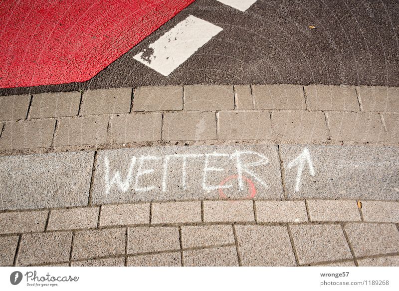 on Traffic infrastructure Street Crossroads Stone Sign Characters Signs and labeling Line Arrow Stripe Gray Red Black White Clue Roadside Pavement Paving stone