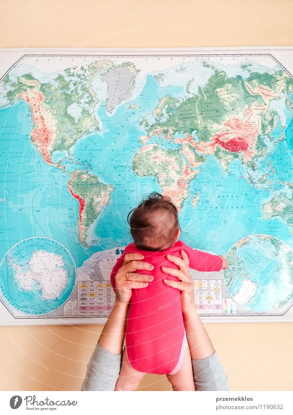 Hello World! Child Baby Girl Father Adults Infancy Hand 0 - 12 months Discover Small Hold kid Map up Vacation & Travel Colour photo Interior shot Copy Space top