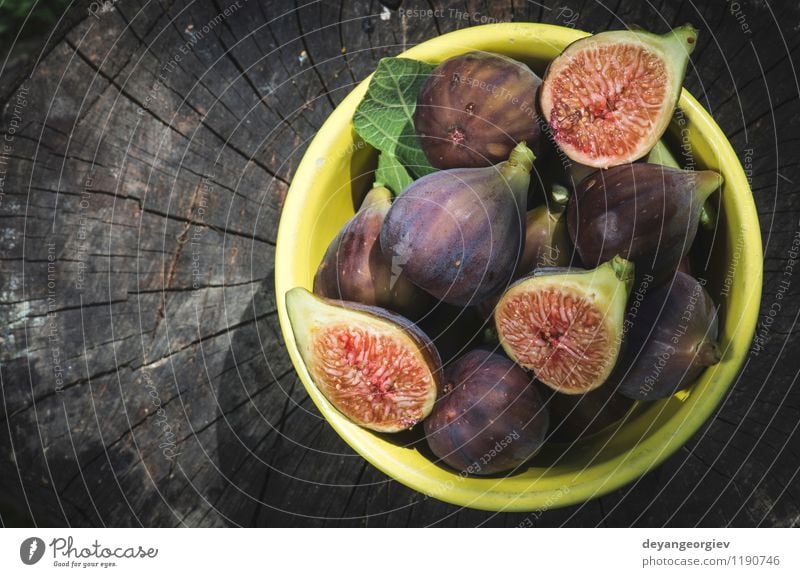 Figs in yellow bowl Fruit Dessert Nutrition Bowl Exotic Table Nature Autumn Fresh Natural Juicy food figs Rustic sweet wood Raw wooden healthy ripe Organic