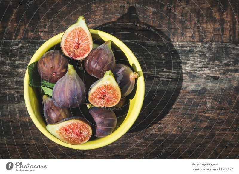 Figs in yellow bowl Fruit Dessert Nutrition Bowl Exotic Table Nature Autumn Fresh Natural Juicy food figs Rustic sweet wood Raw wooden healthy ripe Organic
