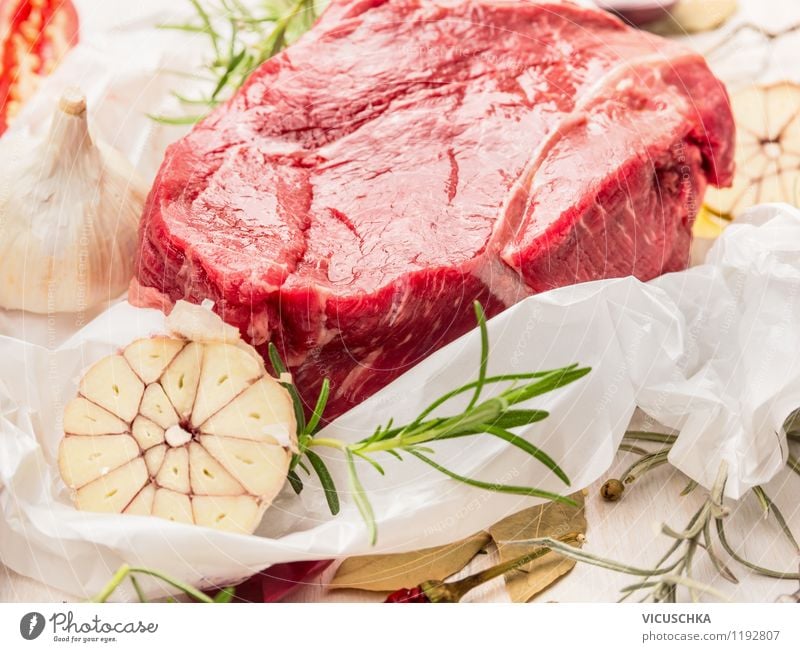 piece of raw fillet of beef with herbs and spices on paper Food Meat Herbs and spices Nutrition Lunch Dinner Buffet Brunch Organic produce Diet Healthy Eating