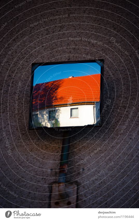 Yard exit with sight mirror. On a dark background the white house with the red roof tiles is well visible. Joy Calm Mirror image Trip Summer Flat (apartment)