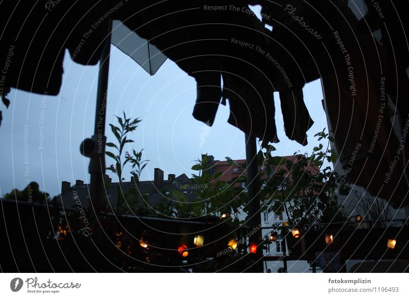 dark evening with fairy lights and clothesline on the balcony Fairy lights House (Residential Structure) Balcony Dark Moody Loneliness Idyll Life Nostalgia