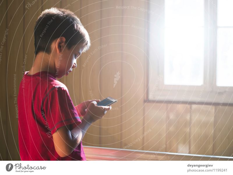 Child playing with mobile phone Joy Playing School Telephone PDA Technology Human being Boy (child) Infancy Small Cute Smart White kid kids young cellphone