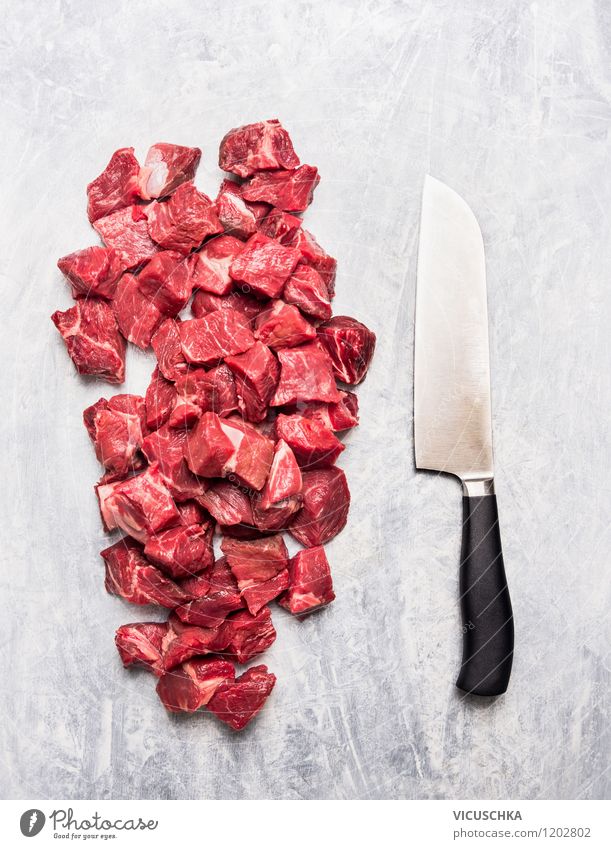 Meat cubes and knives Food Nutrition Organic produce Knives Style Design Healthy Eating Table Kitchen Cook cut Cube Goulash Raw Food photograph Meat-eater