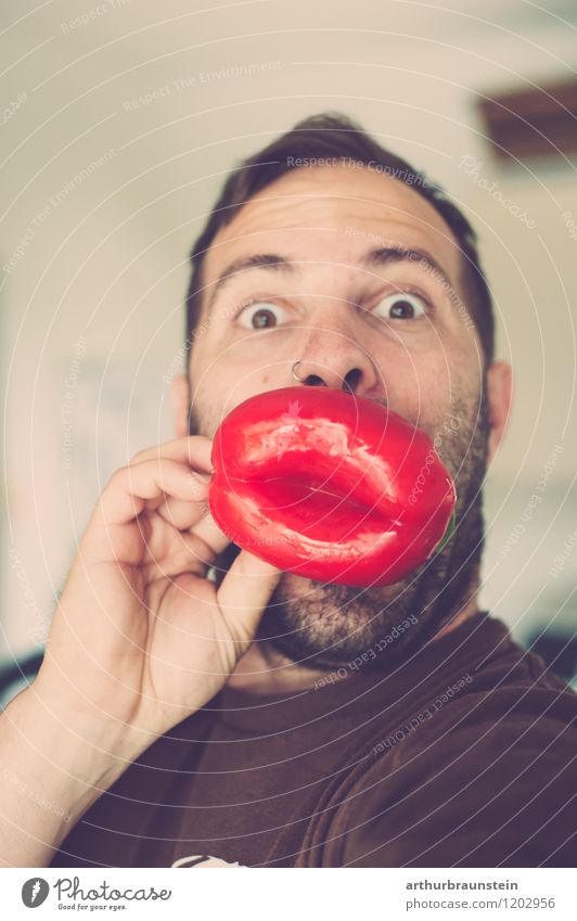 Young man with peppers in the shape of lips in front of mouth Food Vegetable Pepper Nutrition Joy Healthy Playing Human being Masculine Youth (Young adults)