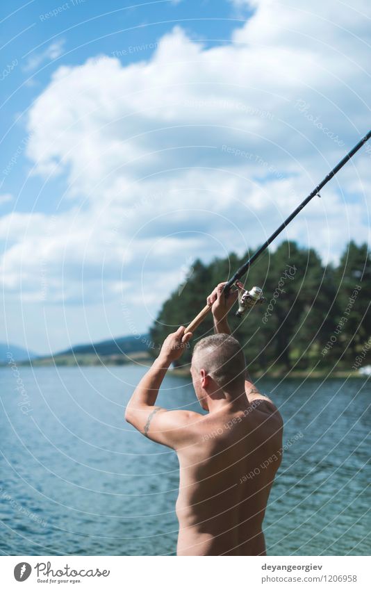 Man on fishing with rod Lifestyle Relaxation Leisure and hobbies Vacation & Travel Summer Sports Human being Adults Nature Landscape Sky Lake River Watercraft