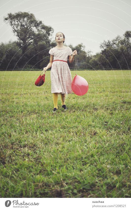 the red balloon . Child Girl Dress Bag Exterior shot Playing Meadow Grass Balloon Red Retro Self-confident Pride drama Dramatic art Actor young girl