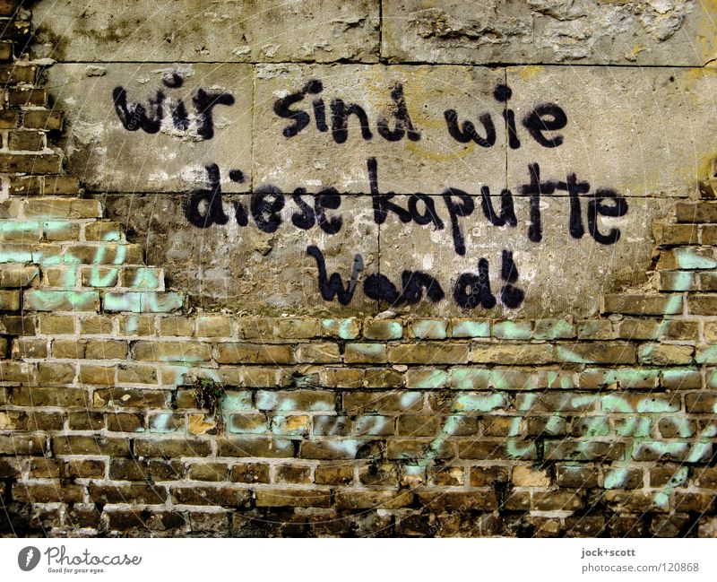 We're what? Smeared on a broken wall Street art Kreuzberg Wall (barrier) Brick Graffiti Word Dirty Hideous Broken Fear of the future Mistrust Contempt Decline