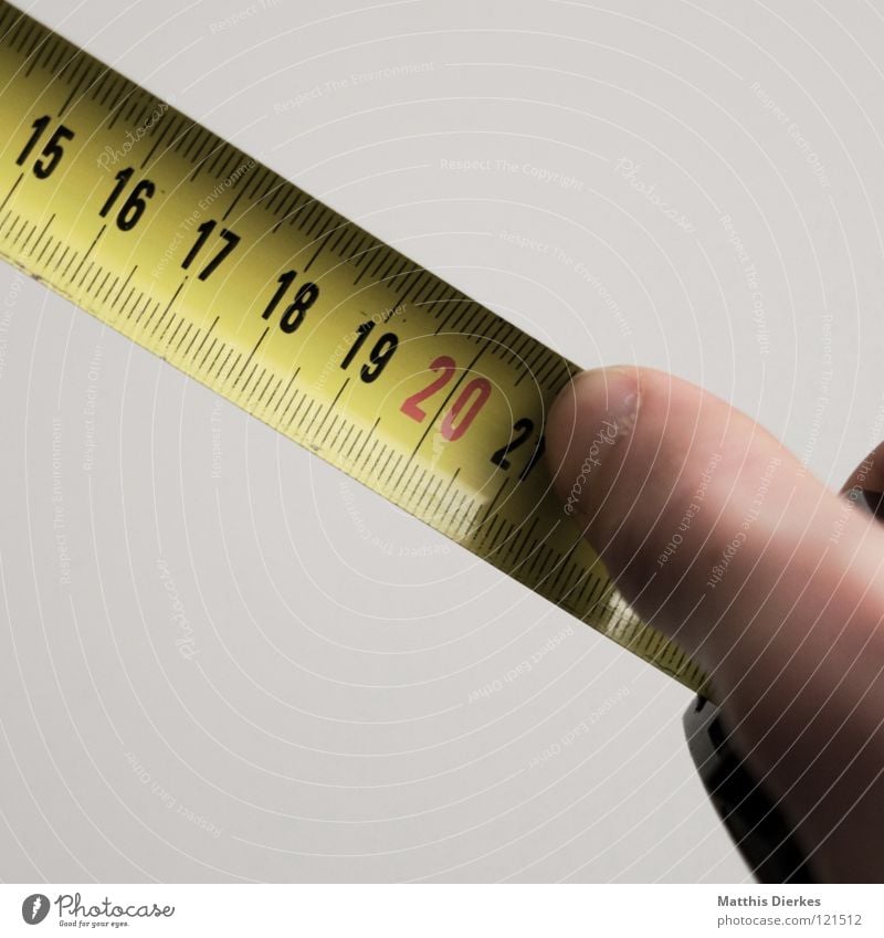 Yellow tailor tape measure on a wooden table, close up - a Royalty Free  Stock Photo from Photocase