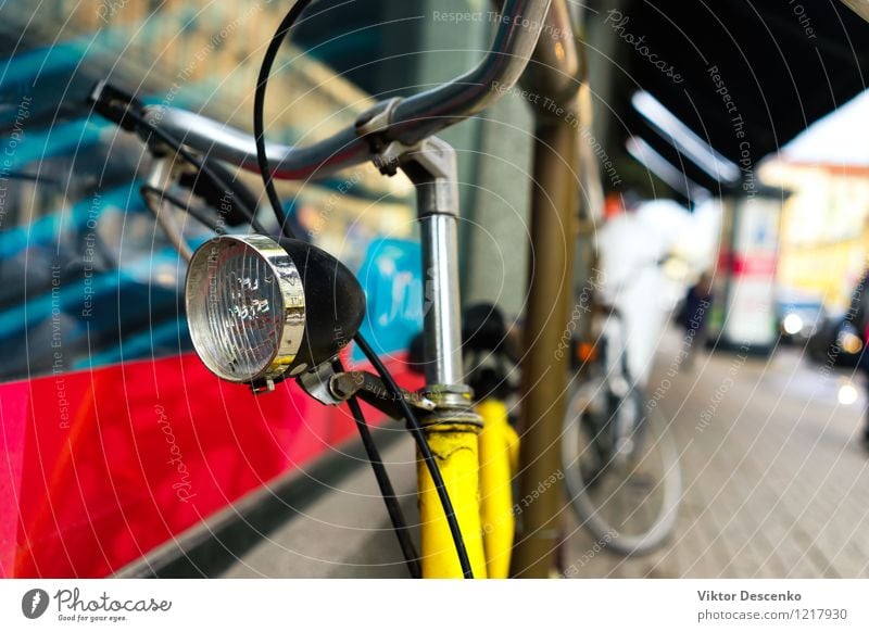 Bike with a headlamp stands on the street Style Design Vacation & Travel Summer Sun Art Town Transport Street Vehicle Metal Rust Old Retro Blue Red White